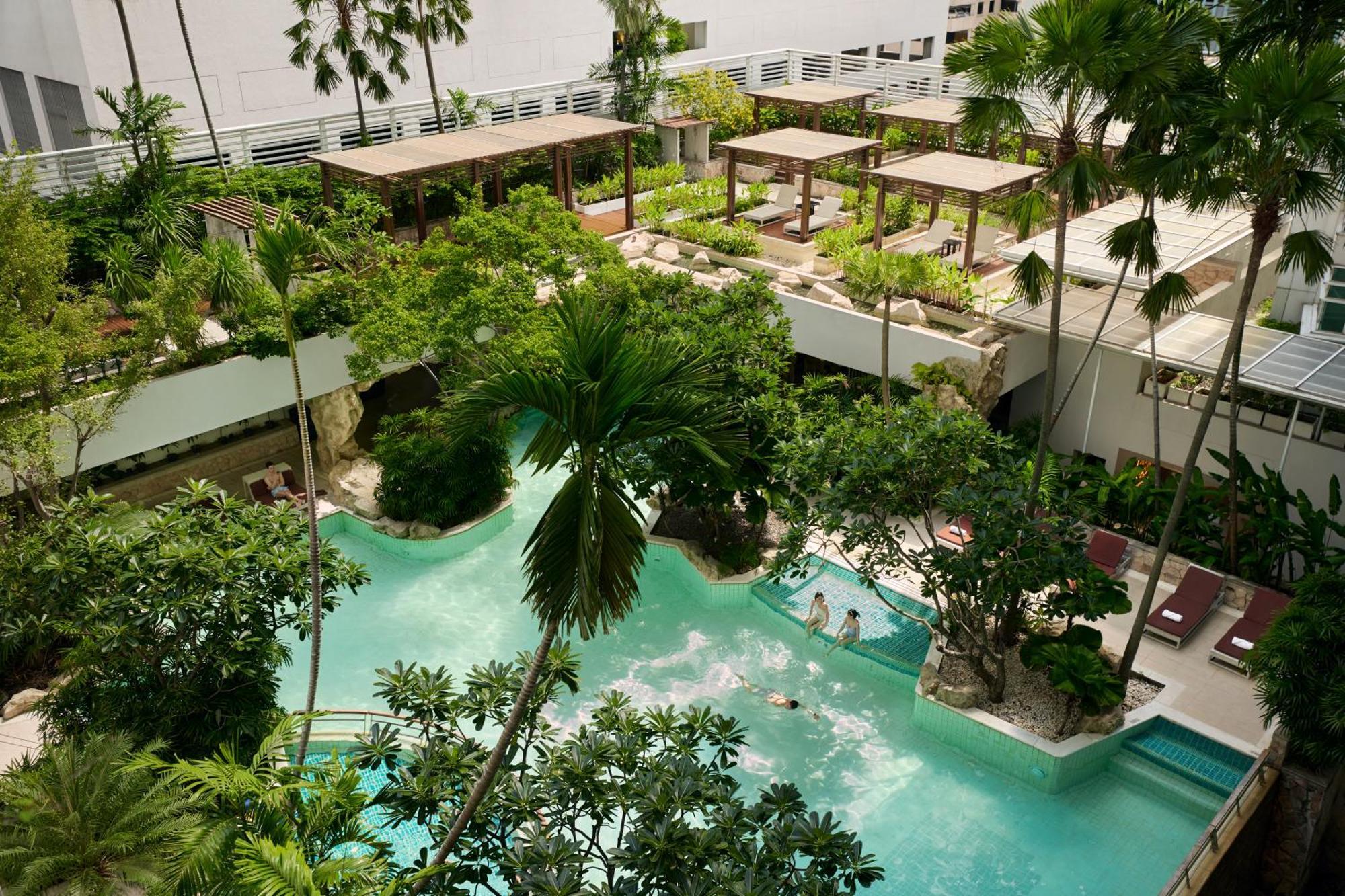 Dusit Suites Hotel Ratchadamri, Бангкок Экстерьер фото The resort's lagoon
